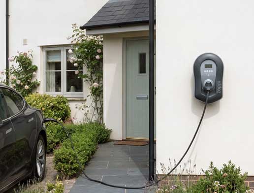 Home EV charger installed on an exterior wall